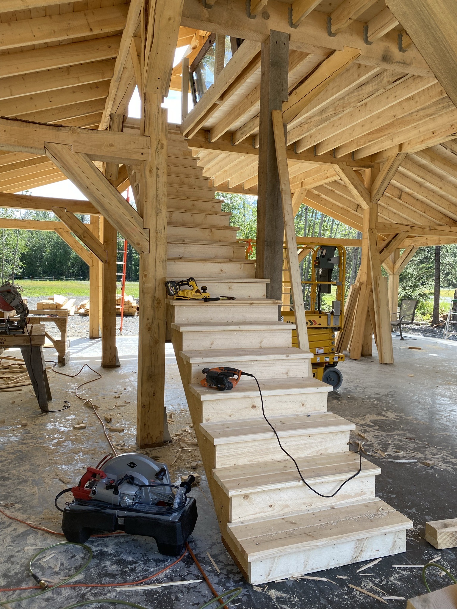 Completed timber frame with roof rafters decked and underlayment installed