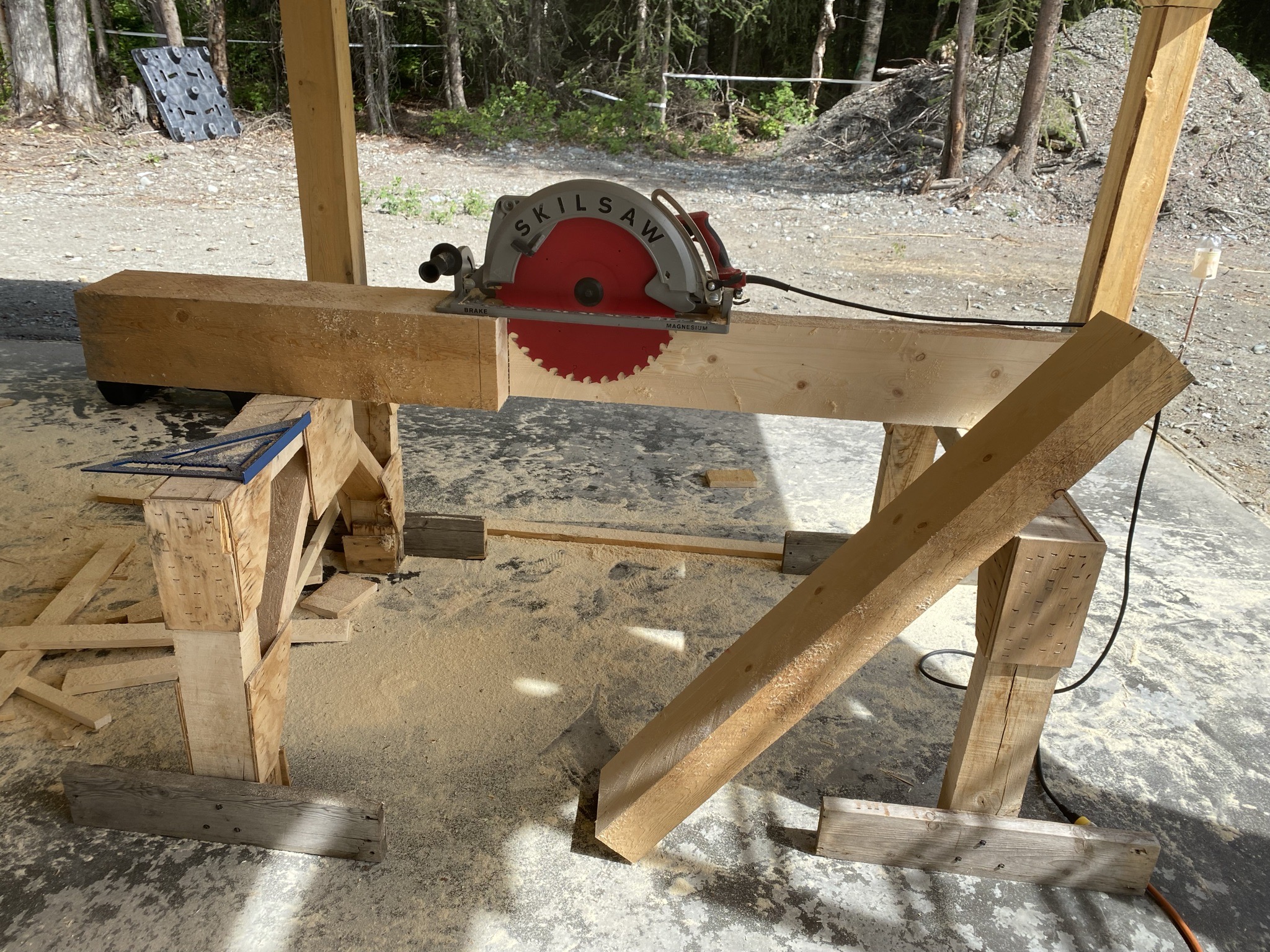 Hand-built solid timber staircase under construction connecting the shop to the studio loft