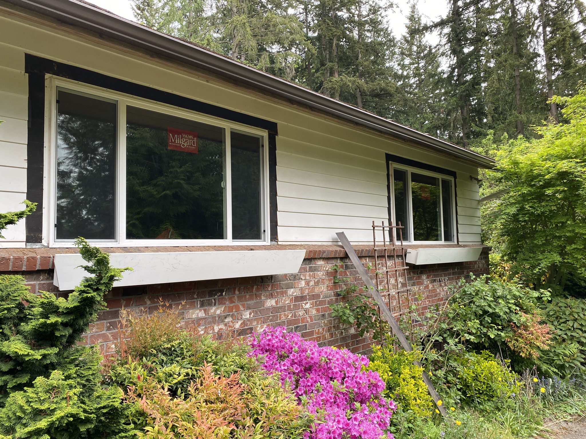 New energy-efficient Milgard windows installed on the exterior of the Issaquah home before painting