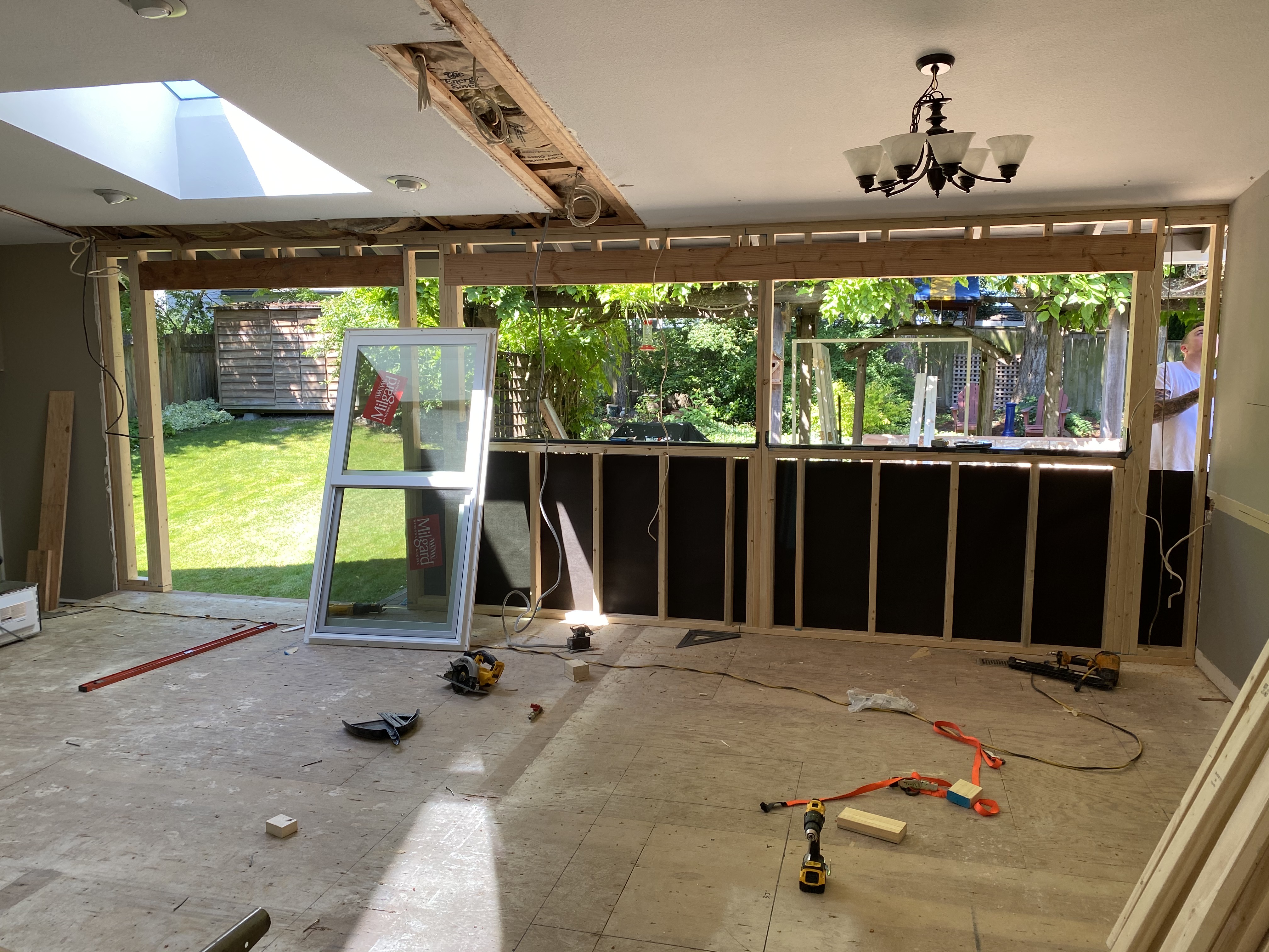 Exterior wall reframed to relocate slider and add windows