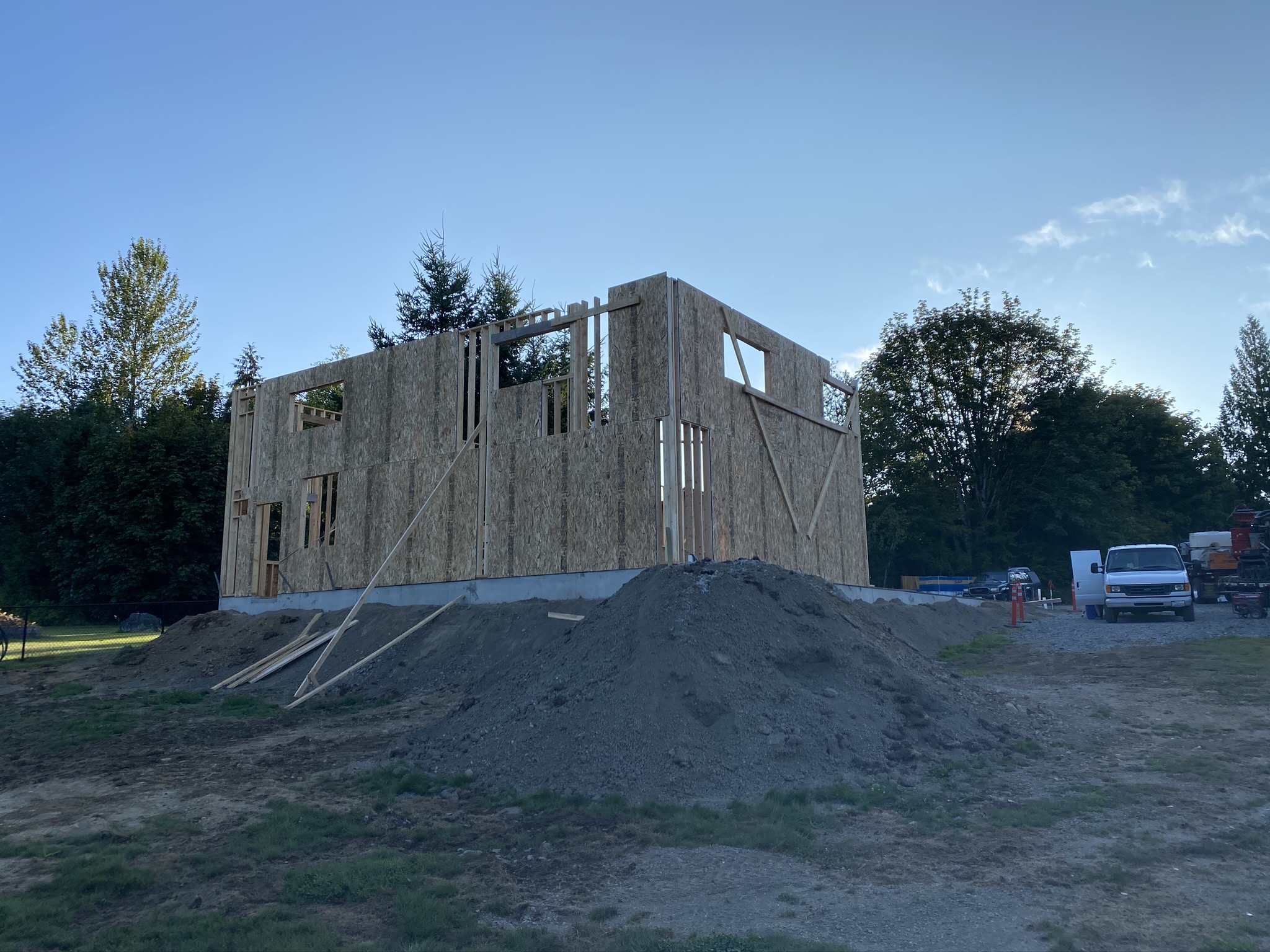 Framed walls on the engineered slab early in the ground-up commercial shop construction in Monroe WA