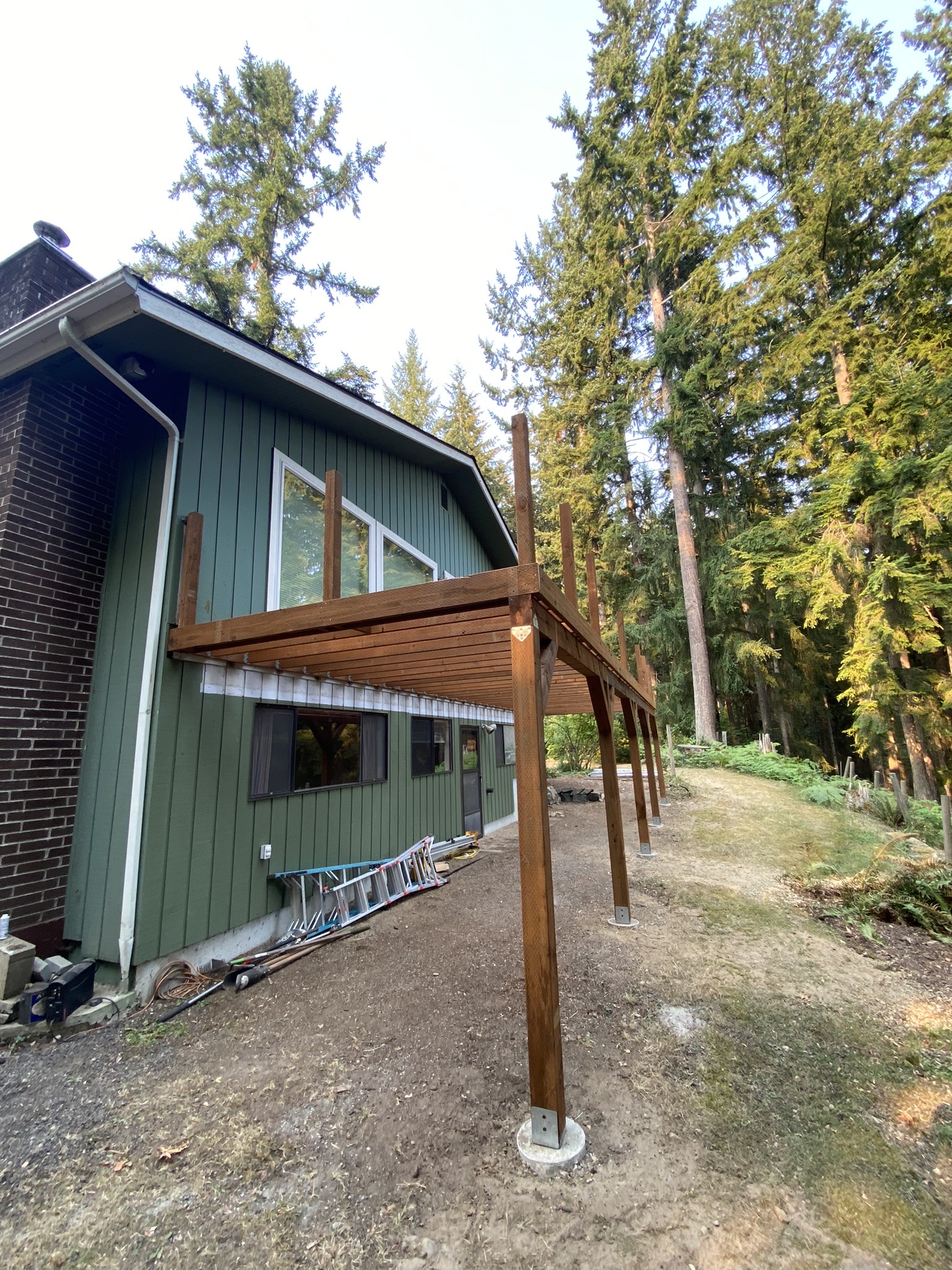 New deck support posts set on footings during week one of the Carnation deck rebuild