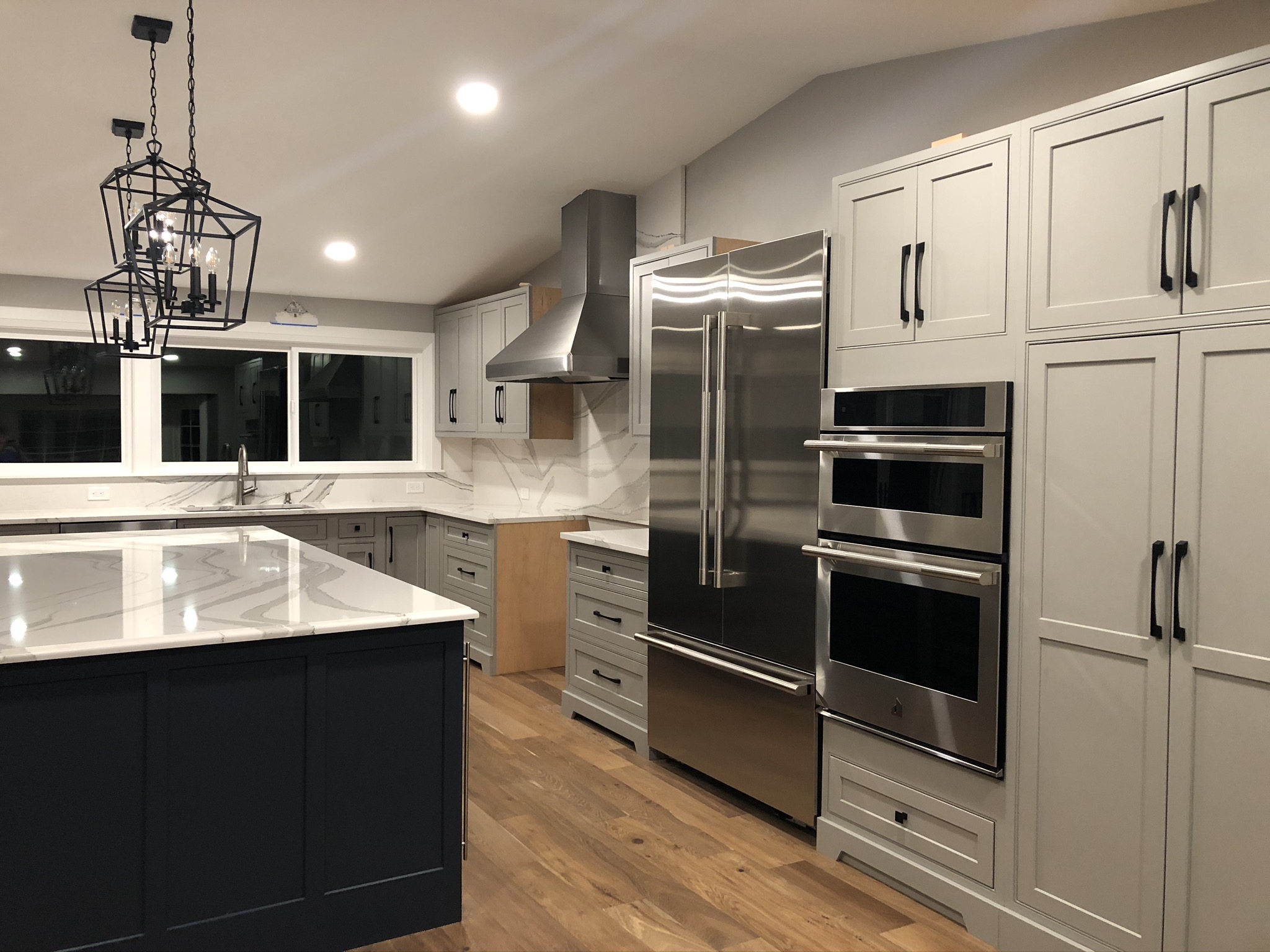 Finished kitchen appliance wall with hood and double wall oven