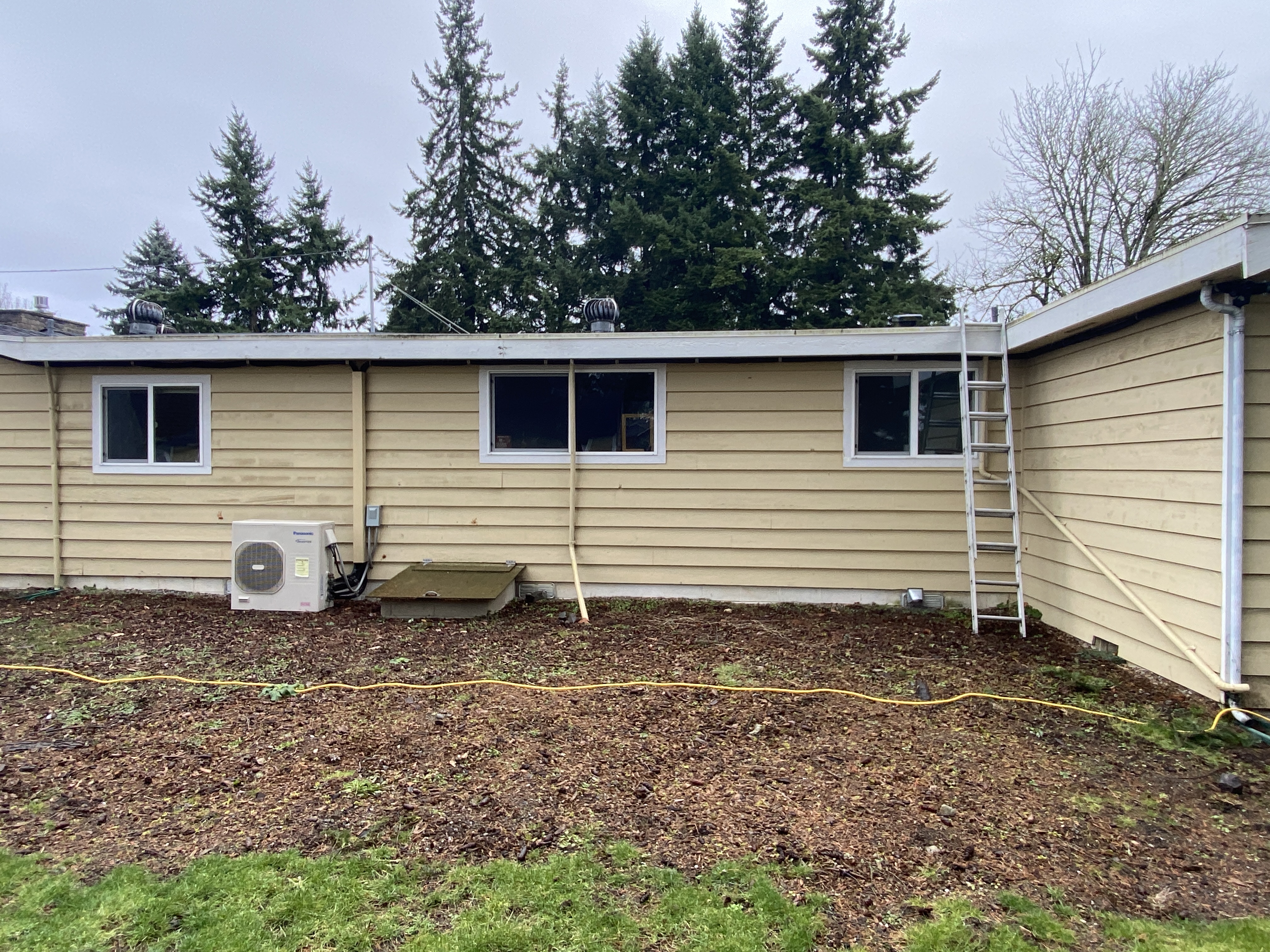 Empty Kenmore Washington backyard before the outdoor living transformation by Pelletier Construction