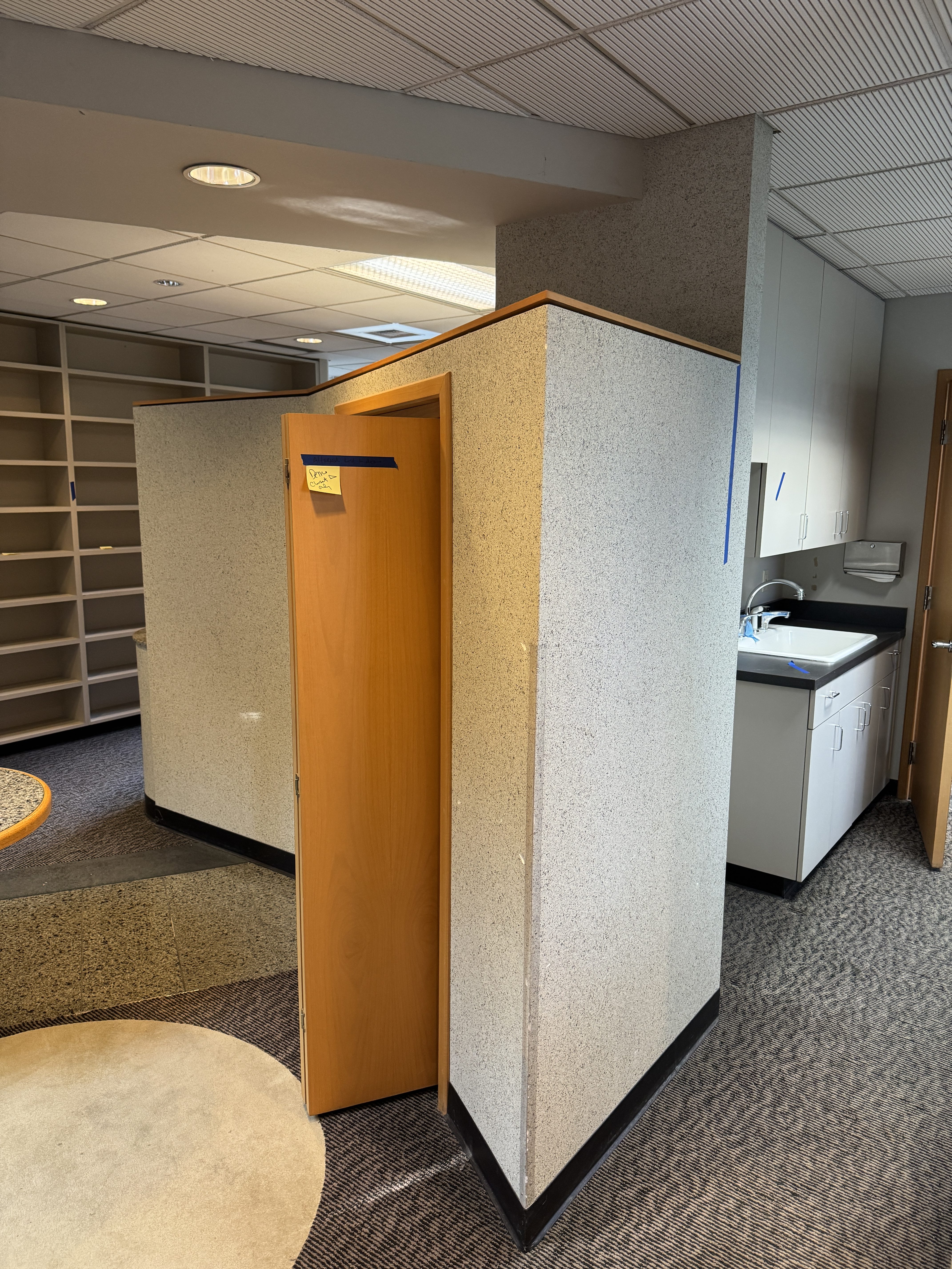 Freestanding dental operatory partition pods and built-in sink prior to demolition